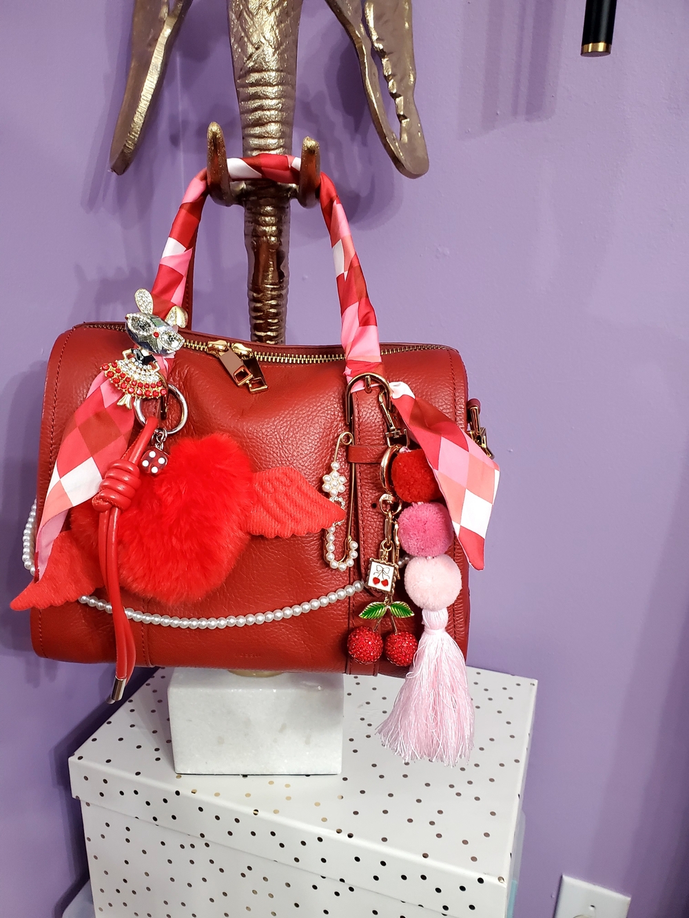 Red Leather Satchel Handbag with Decorative Charms